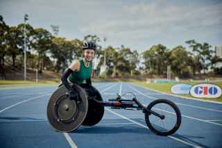 Smiling-woman-in-wheelchair-on-racetrack-coco